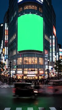 Green Screen large billboard with a for advertising on the modern building busy crossroad neon lights traffic crowd tokyo japan scene 3 distortion, overlay, glitch, static noise, scan lines black