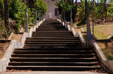 Fototapeta premium staircase in the santa olimpia neighborhood, in piracicaba, with the Maria Estrela da evangelização Parish in the background