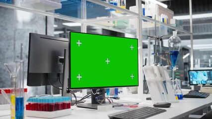 Blood samples next to green screen PC in laboratory used to process patient data for clinical research. Test tubes and pipettes next to mockup computer used for genetic analysis diagnostics in lab - Powered by Adobe