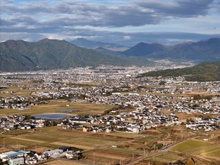 A city with a lot of houses and a lot of land. The houses are spread out and the land is mostly empty