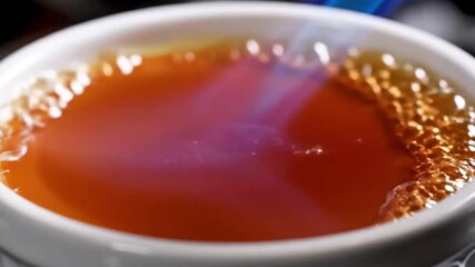 45° cinematic shot torching crème brûlée, blue flame, glossy caramel texture, macro detail - Powered by Adobe