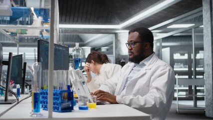 Portrait of smiling laboratory scientist using computer monitor, processing DNA patient data for clinical research. Cheerful african american lab worker looking at analysis diagnostics on PC, camera A - Powered by Adobe