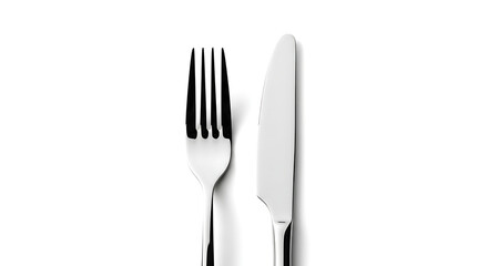 A silver fork and knife are placed side-by-side on a white surface, viewed from directly above.