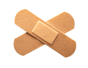 Two adhesive bandages crossed on transparent background health care concept