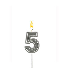 Candle number 5 - Lit birthday candle on white background