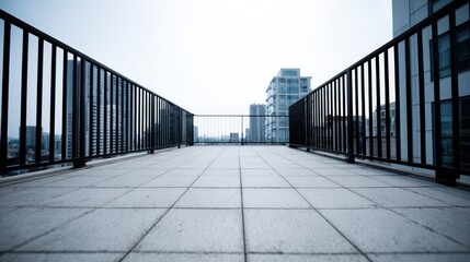 Obraz premium Rooftop Balcony View with Cityscape, Modern Architecture, and Geometric Tile Pattern on a Cloudy Day