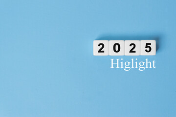2025 Highlights inscription on blue background. Major events, overview, looking back at 2025 year concept.