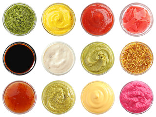 Various condiments in bowls isolated on white, set. Top view