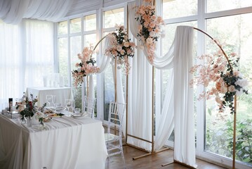 Elegant Table Setting with Floral Arch Decoration
