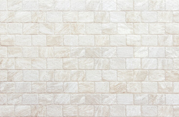 Detail of modern cream brick wall background photo. White light brick wall texture background for stone tile block painted in beige light color wallpaper modern interior and exterior backdrop design.