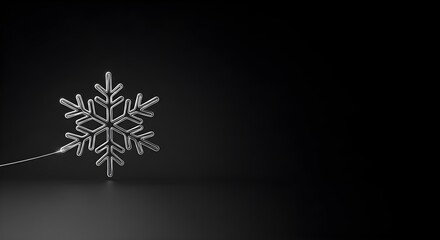 Metallic snowflake ornament against dark backdrop with copy space