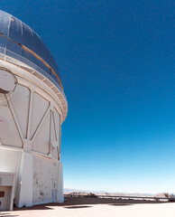 Fototapeta premium Astronomical observatory under clear blue sky in Cerro Tololo, northern Chile