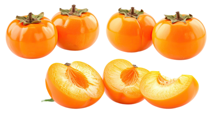 Ripe persimmons; some whole, others sliced open on black