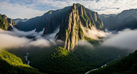Majestic mountain peak with mist and lush forest river flowing through valley
