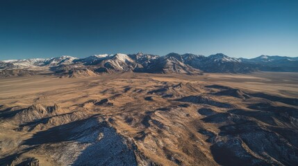 Breathtaking aerial view of rocky mountain landscape high altitude nature photography clear skies expansive terrain