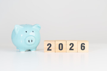 Happy New Year 2026 with piggy bank. Resolution, Goals, Plan, Action, Money Saving, Retirement fund, Pension, Investment and Financial concepts