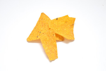 Three brightly colored, cheese-flavored tortilla chips isolated on a clean white background. Perfect close-up for advertising, packaging, snack food.