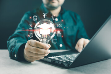 E-learning graduate certificate program concept. man holding lightbulb showing graduation hat....