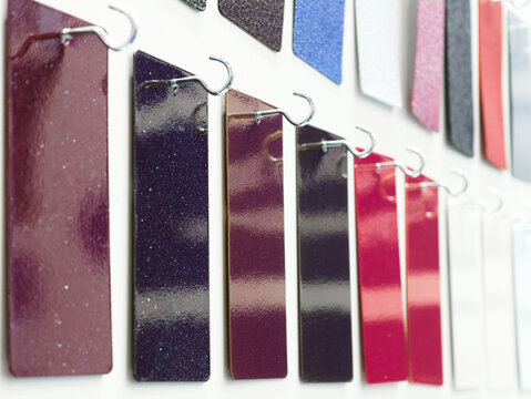 Colorful swatches of shimmering nail polish displayed in an artful arrangement capturing a vibrant array of hues and finishes