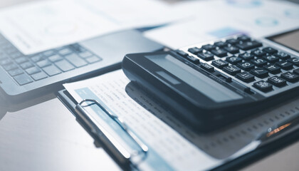 analysis, accounting, finance, Close-up of a calculator and financial documents on a desk,...