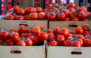 Boxes of red tomatoes are for sale at a food shop in Michigan USA