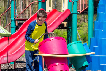  Young boy Playing with drums at a play ground