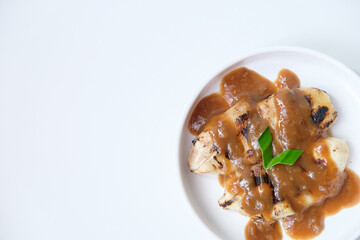 Pisang gapit or pisang epe, grilled banana with palm sugar sauce, Indonesian traditional food.