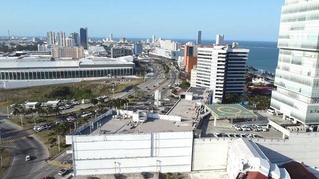 Drone view of Boca del R&iacute;o featuring Playa Mocambo and the vibrant area between Plaza Am&eacute;ricas and Plaza Andamar under the afternoon sun.