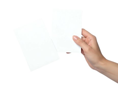 A hand holds a rectangular white card next to another similarly-shaped card on a black background