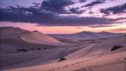 Naklejka premium Serene desert dunes under a dramatic sunset sky