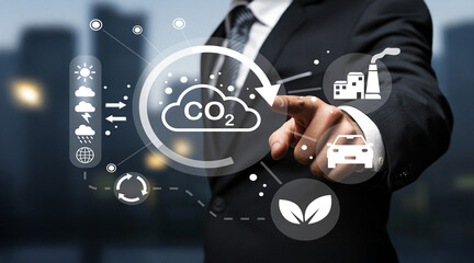 Businessman in Suit Interacting with Digital Graphics Representing Carbon Emissions, Environmental Impact, and Sustainable Solutions in Modern Cityscape