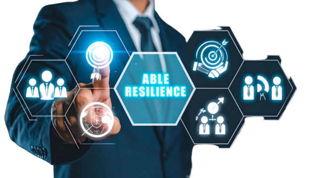 Businessman points at digital "Able Resilience" interface, with icons of teamwork, goals