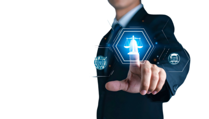 A person in a suit interacting with a digital display showing a glowing justice symbol