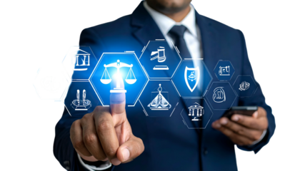 Businessman pointing at digital law icons; concepts of justice, technology, and law integration