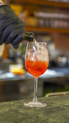 Refreshing Aperol Spritz cocktail served with ice and orange slice for a delicious aperitivo