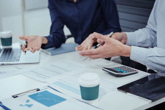 Group Asian professionals in business casual attire engaged in modern education,combining edutainment with skill upskilling,blockchain innovation,decentralized finance learning in office environment.