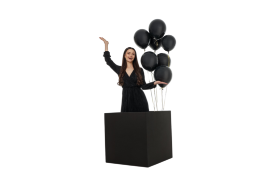 Woman with black balloons smiles from a black box, isolated, PNG