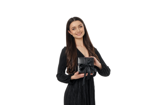 Woman excitedly holds a gift box for Black Friday, isolated, PNG - Powered by Adobe