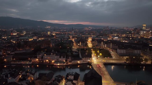 sunset sky night illumination zurich city center riverside traffic streets aerial panorama 4k switzerland     