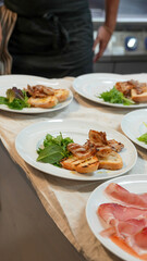 Gourmet appetizer platter with a variety of Italian antipasti beautifully arranged on a wooden board