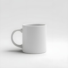 Fototapeta premium A white ceramic mug is displayed with its handle facing the viewer, set against a pure white backdrop. The image focuses on the mug's clean lines and unadorned surface, captured with soft, even illumi