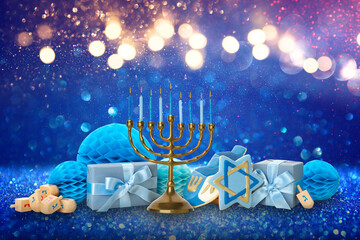 Colorful Hanukkah decorations with a menorah and dreidels