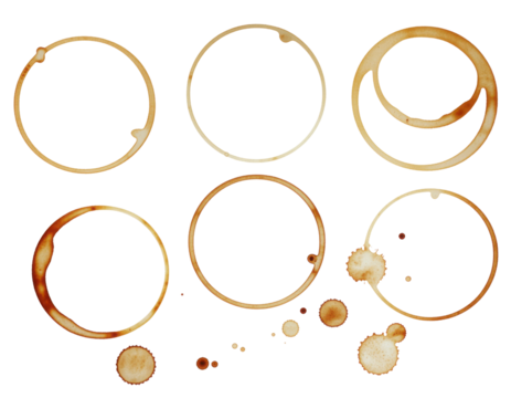 Various coffee cup stains in circular shapes, featuring different sizes and patterns, showcasing the remnants of liquid on a dark surface.