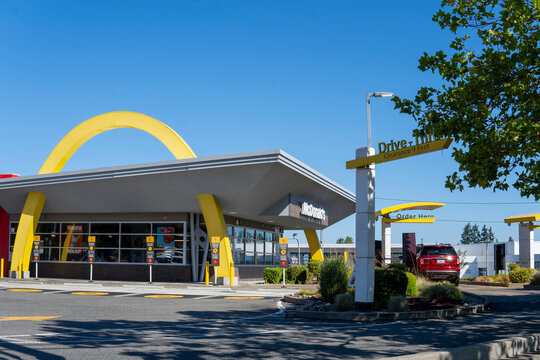 McDonald's restaurant building with drive thru in sunny day. International fast food restaurant chain. Everett, WA, USA - July 30, 2025