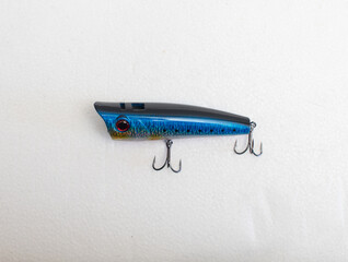 Metal fishing lure on white background
