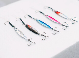 Metal fishing lure on white background
