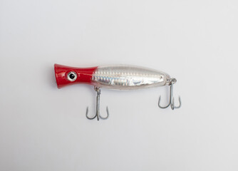 Metal fishing lure on white background