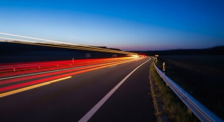 Obraz premium Highway Lights Evening Speed with Motion Blur on Road.
