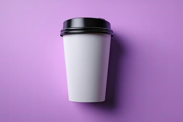 White paper coffee cup with black lid on a purple background