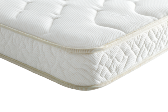 Close-up of white mattress corner with stitched edge
